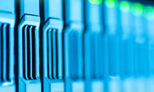 Detailed image of a server rack with glowing lights in a modern data center.