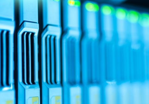 Detailed image of a server rack with glowing lights in a modern data center.